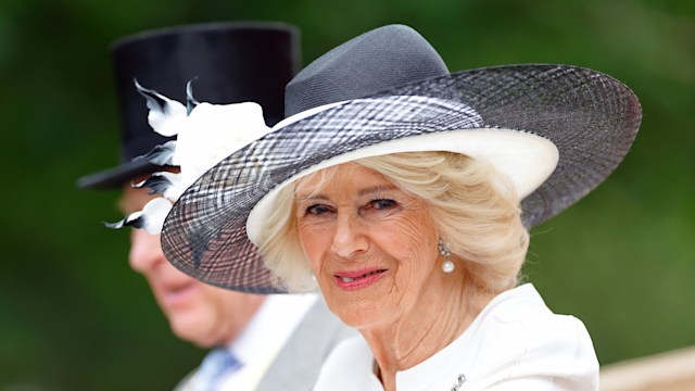 Queen Camilla side on in white hat