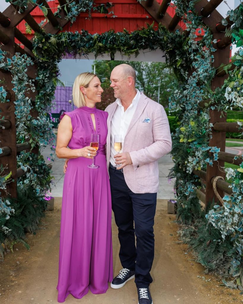 Mike Tindall and Zara Tindall in smart clothes gazing into one another's eyes 