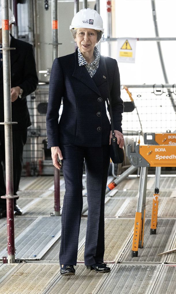 Princess Anne in fitted flares and hard hat