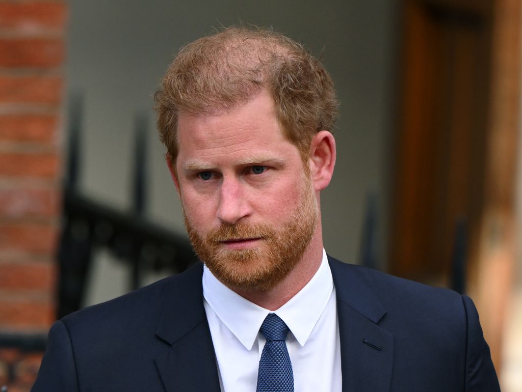 Prince Harry looking serious outside high court