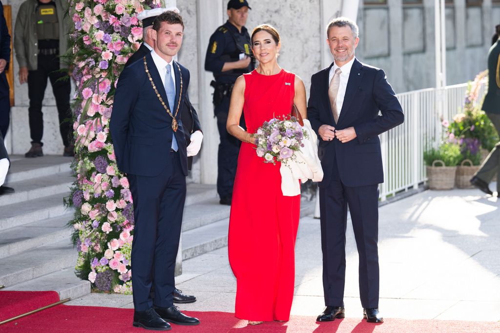 Queen Mary wearing red dress at Aarhus City Hall