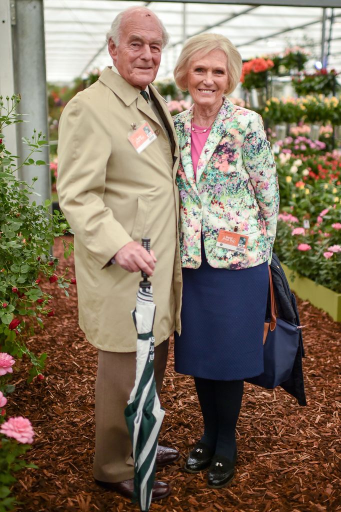 Paul Hunnings and Mary Berry standing in between flowers