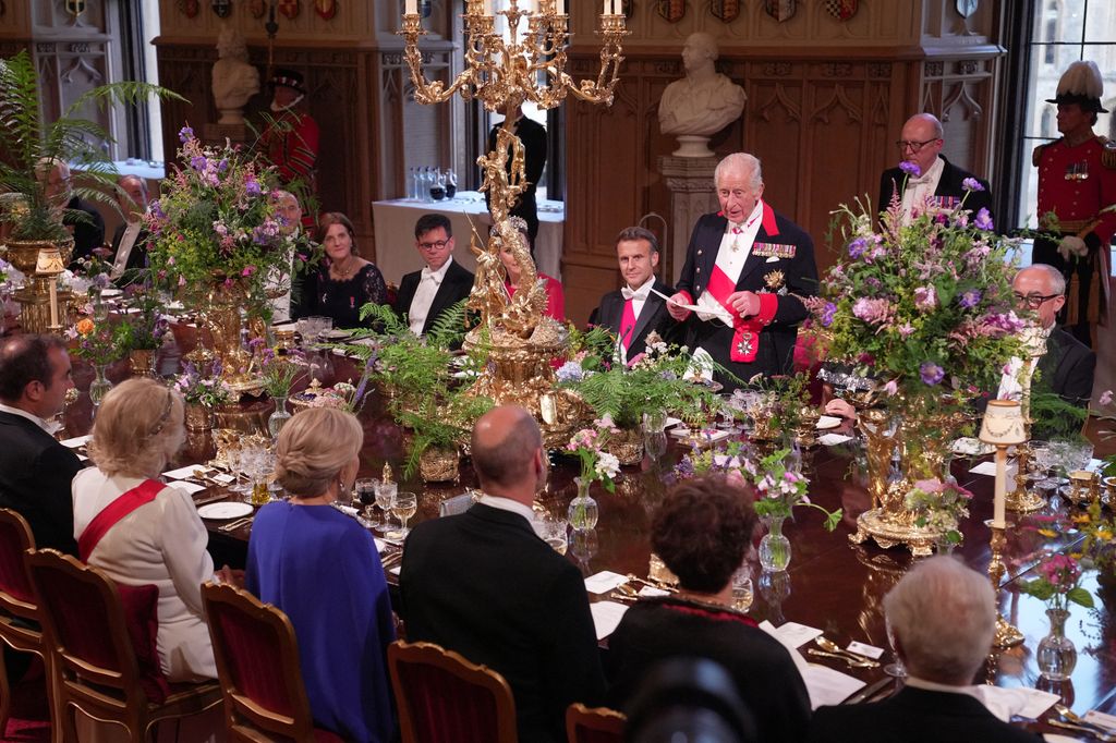 Britain's King Charles III delivers a speech beside France's President Emmanuel Macron during a State Banquet