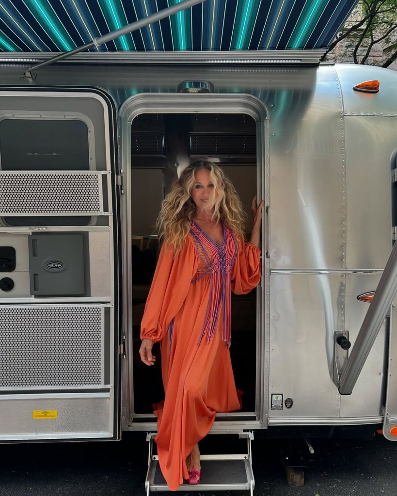 SJP in orange smock dress